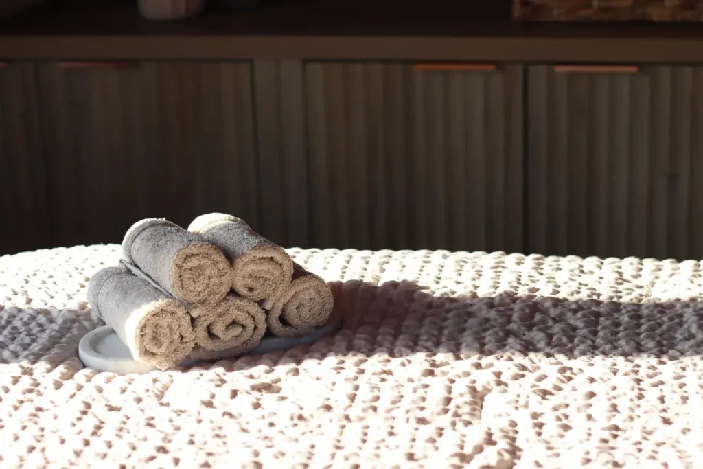 Rolled towels on cabin bed for A Little More package